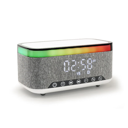 Alarm clock with speaker and wireless charging function with light